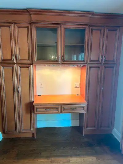 Wood kitchen cabinets desk/storage unit, microwave, GE gas range, custom buffet and upper cabinet un...