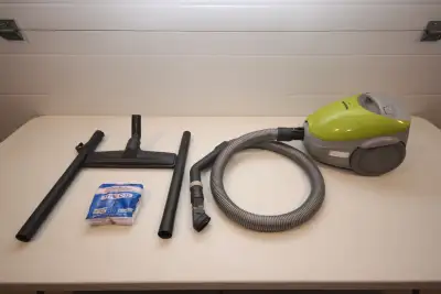 SMALL PORTABLE PANASONIC VACUUM. IDEAL FOR RV OR SMALL AREA. ALL ACCESSORIES PLUS 4 EXTRA BAGS.