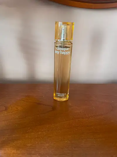 Cookies & Kisses fragrance by Clinique. (Travel size). One spritz used (enough to know it will not w...