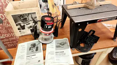 Craftsman router, barely used. Comes with table, 2 bits, users manual and instructions, and accessor...