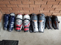 Many Hockey Shinguards, Pants, Hloves and Helmets/Cages