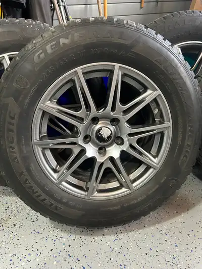 A set of General Artimax 245/65/17. the tires are mounted on a aluminum allot rims complete with sen...