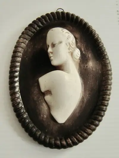 This is a beautiful 1930's Art Deco chalk ware plaster cast three dimensional oval plaster wall plaq...