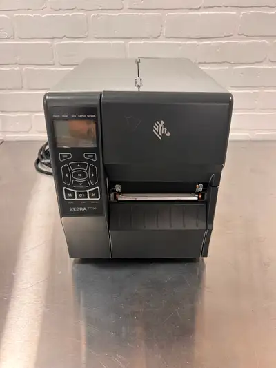 For sale is a Zebra ZT230 thermal label printer in good working condition. This is a solid commercia...