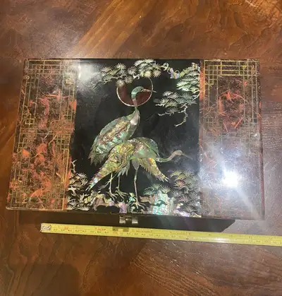 This vintage Korean wooden jewelry box is adorned with an inlaid Mother-of-Pearl (MOP) design, featu...