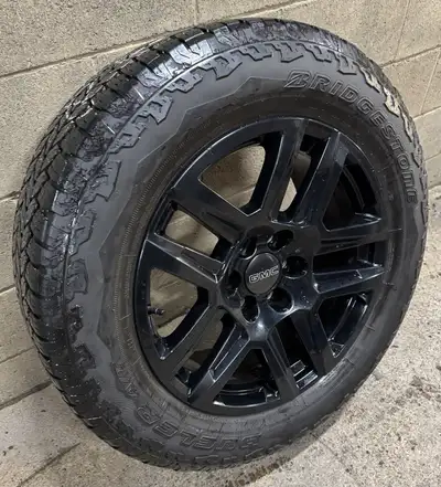 Set of OEM Wheels and Tires. 275/60/20 OEM Bridgestone A/T - 9/32nds Late 2024 DOT Code. Tires went...