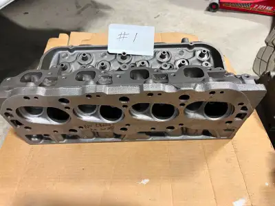 Two sets of Chevy heads cleaned and checked by machine shop. One set 427 hi performance date coded 1...