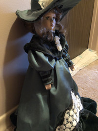Ceramic doll on stand 