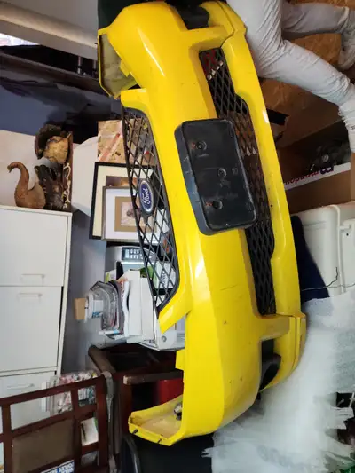 Up for sale is a bright yellow Ford Focus bumper, designed to give your ride a sporty and aggressive...