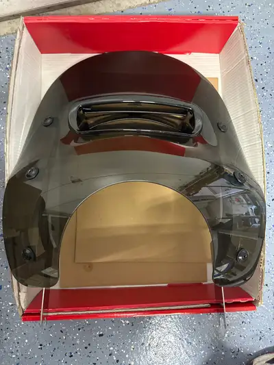 This Harley-Davidson Touring fits Road King. Windbreaker shield offers riders enhanced protection fr...