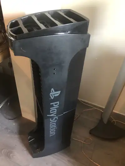 Have this PlayStation stand to hold games, joysticks and a console at the bottom (see last pic), It...