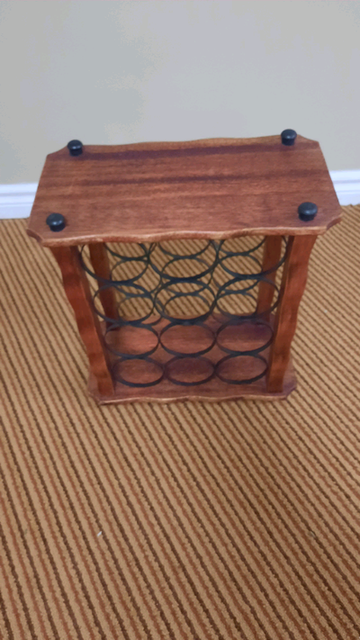 12 bottle antique wooden wine holder rack in very good condition. 18"high,17'wide and 9" deep.Simila...