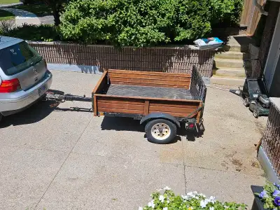 6' x4 1/2' Utility Trailer. Surface rust but solid little trailer. Front folds down to accept 8' she...
