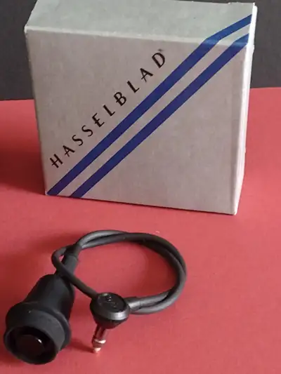 Hasselblad Accessories: Camera straps complete with clips ELM remote release Tripod quick coupling B...