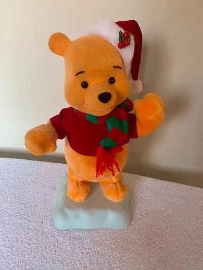 This is a Winnie the Pooh decorative figurine. Disney. 16" tall. 7" wide at the base. Has an on/off...