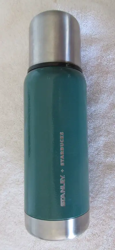 Starbucks Stanley Green Stainless Steel Coffee Thermos. 17 oz. 10 in. tall. In very good condition.