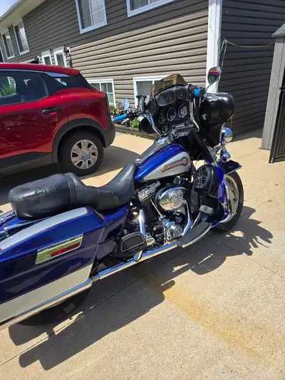 Get ready to hit the open road on this striking two-tone blue and silver Harley-Davidson Touring mot...