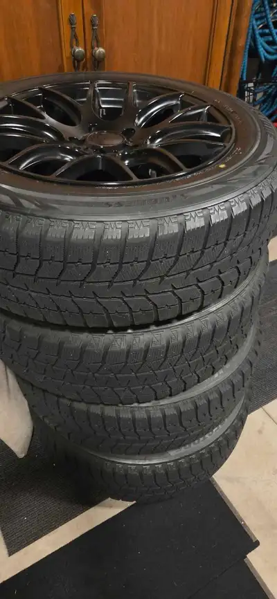 Aluminum Rims with winter tires. These tires are over 7 years old but still grip the snow and ice li...