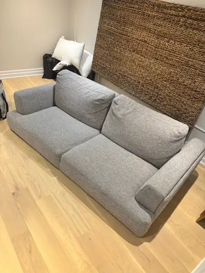 This stylish grey Structube couch offers a modern touch to any living space with its clean lines and...