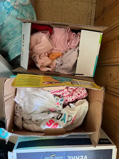 3 diaper boxes full of girls clothes Size 6-12 months. Variety of items Hats, sweaters, jeans, tops,...