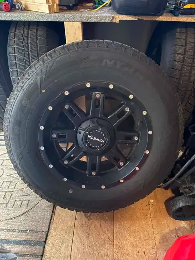 Get ready for winter with this set of four 265/70R18 Antares winter tires mounted on 18x9 Shaft blac...