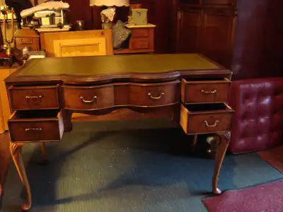 Top quality walnut desk with new English leather top. 5 drawers & gabriole legs. Excellent condition...