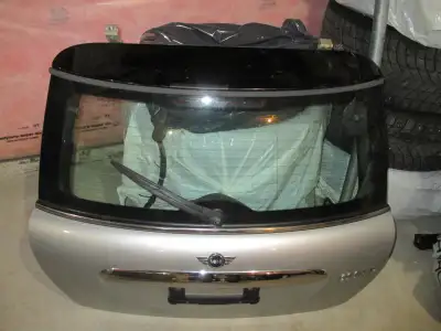 I am selling a selection of genuine Mini Cooper body parts, including a rear hatch, doors, and a fen...