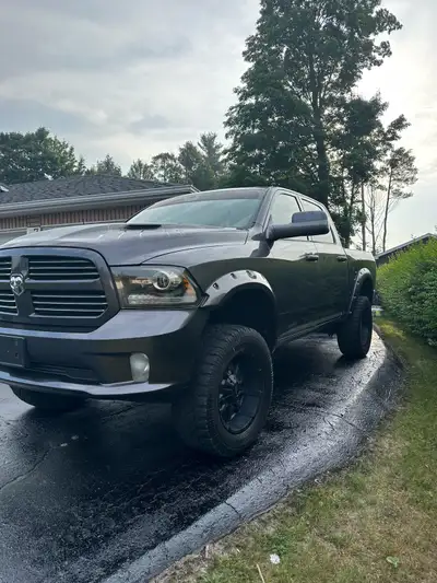 2014 Hemi, 5.7, has 4 1-2” rough country lift kit. 35” tires, meticulously maintained, no rust, upgr...