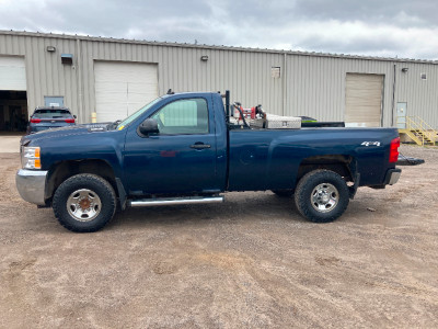 2010 Chevy Silverado 2500 with slip tank and plough mount