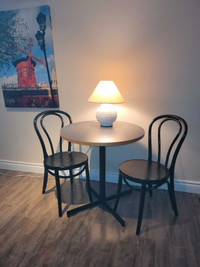 Round table with two chairs