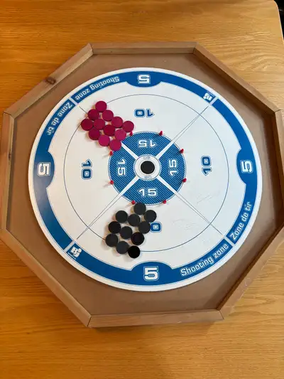 This is a double-sided Crokinole and checkers game set with wooden crown pieces, perfect for family...