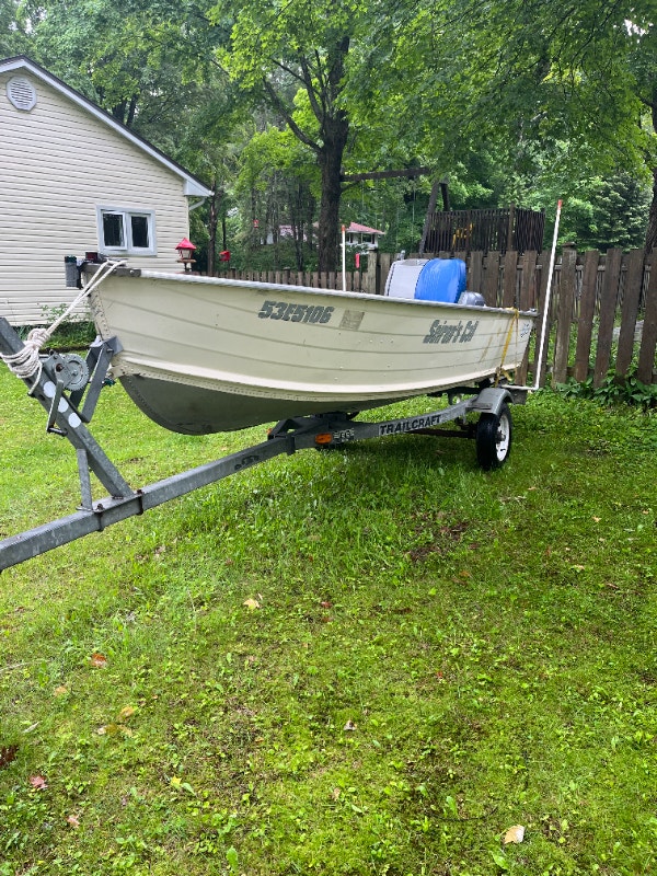 14 ft. Sylvan Boat motor and trailer Powerboats & Motorboats