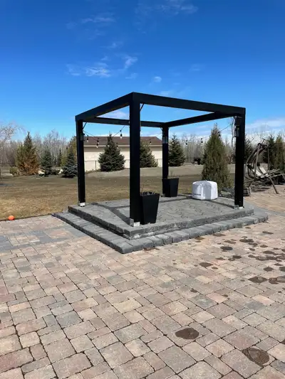 10’ x 10’ freestanding pergola, approx. 8 ft high, built with 6x6 pressure-treated posts wrapped in...