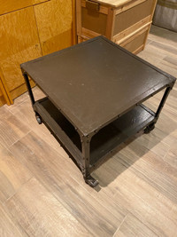 Industrial look coffee table on casters