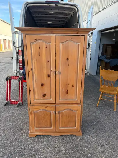 180$ 90 inch by 21 inch 70 inch high Used Pine wood armoire with two top doors and two bottom doors....
