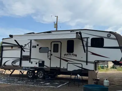 We are located in La crete Alberta Year 2016. 285bhs travel trailer Super good shape , single on sin...