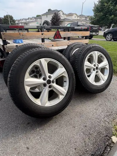 Selling a like new set of winter tires on alloy rims with TPMS sensors. Lots of tread left, low mile...