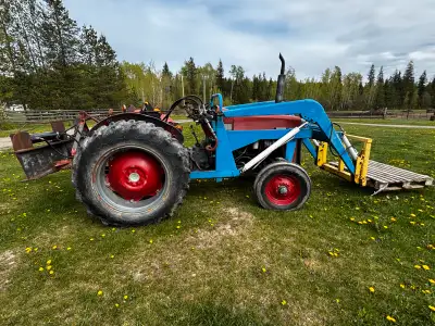 45 horse power Loader tractor Has changeable heavy bale forks and bucket Comes with rear 7ft heavy d...