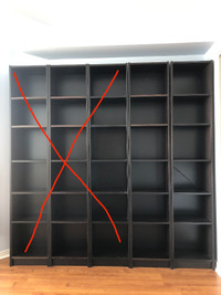 Two black, tall IKEA Billy bookcases