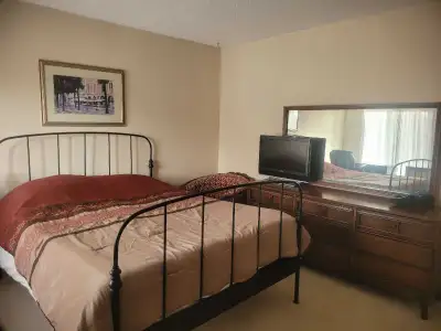 This is a private bedroom available in a large house. It is furnished with a bed, desk, and chair. T...