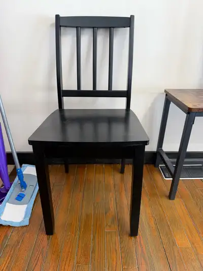 Two black wooden chairs, View more
