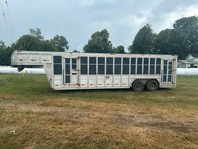 1999 Barrett livestock trailer. 26’ long. Heavy built trailer. Could use some work on a few doors bu...