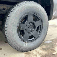Bridge stone winter tire set with 90s Chevy rims spray painted  