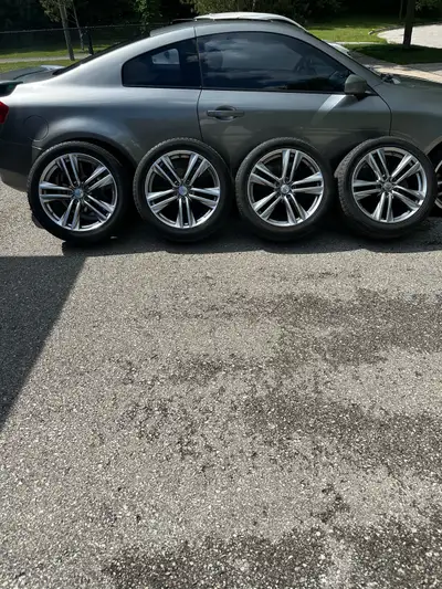 These pre-owned Infiniti QX50 19-inch wheels come mounted with Yokohama Avid Ascend GT tires in size...
