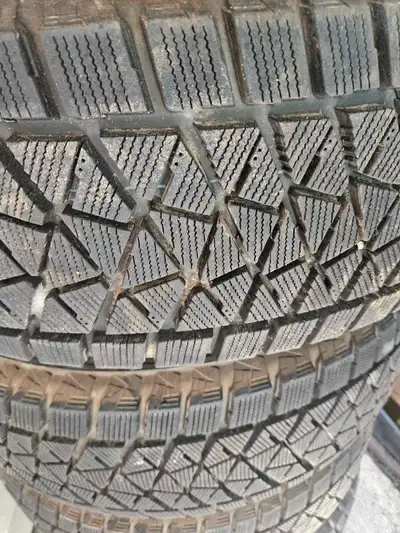Set of 4 winter tires and rims. Low Mileage.
