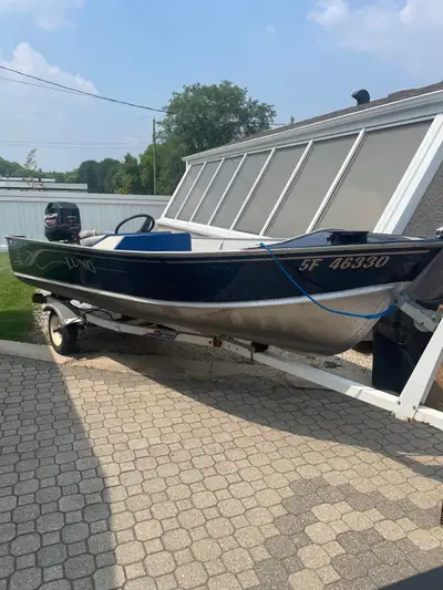 1983 Lund 16ft console with 1985 EZ loader trailer & 1999 Mercury 50HP 4 stroke motor. Included: Tro...