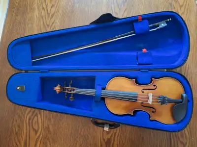 3/4 size west German violin. Bow and case included.