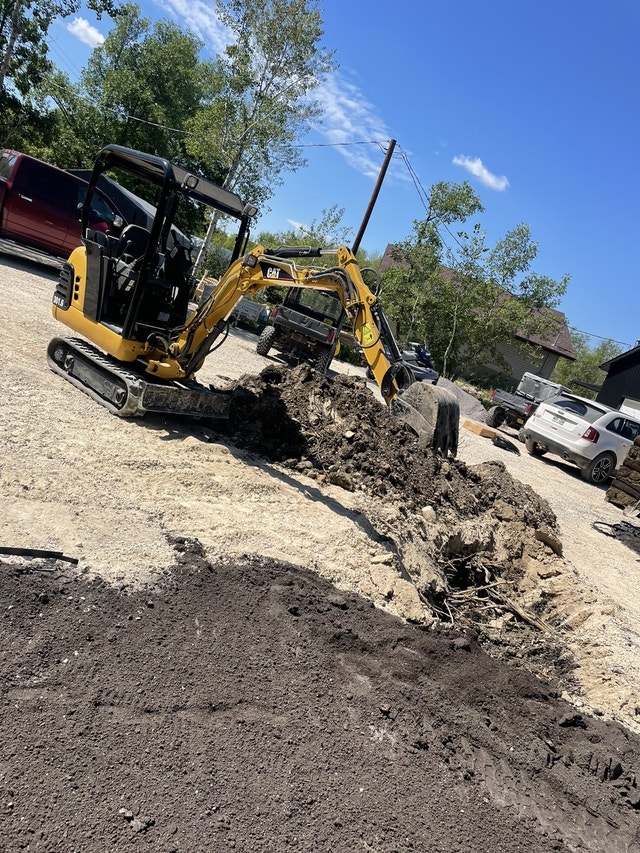 End of year skid steer and mini excavator services Excavation