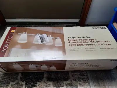 This vanity light has been put up once to realize it hangs below our mirror and then returned to the...