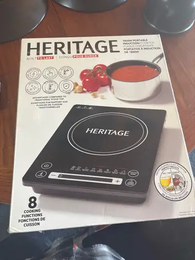 Heritage rock induction cook top brand new in box. $50 call 780 2361895